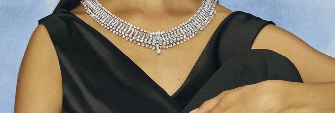 Echo necklace and ring being worn