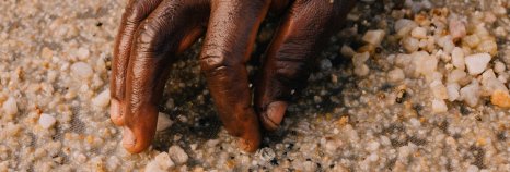 Miner hand picking diamond